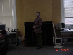 Greg looks very stately in front of the fireplace.