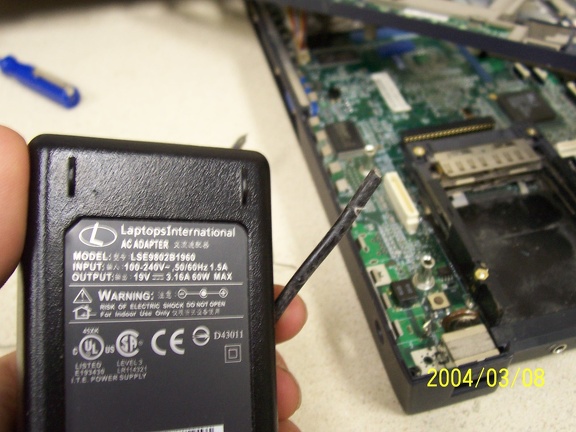 One mutilated ac/dc adapter suitable for this laptop... check.