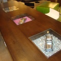 the one table that had nice little cars in it with glass covering them