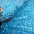 John trying to make whirlpools in the pool
