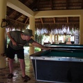 John playing pool on the left