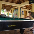 John playing pool on the right